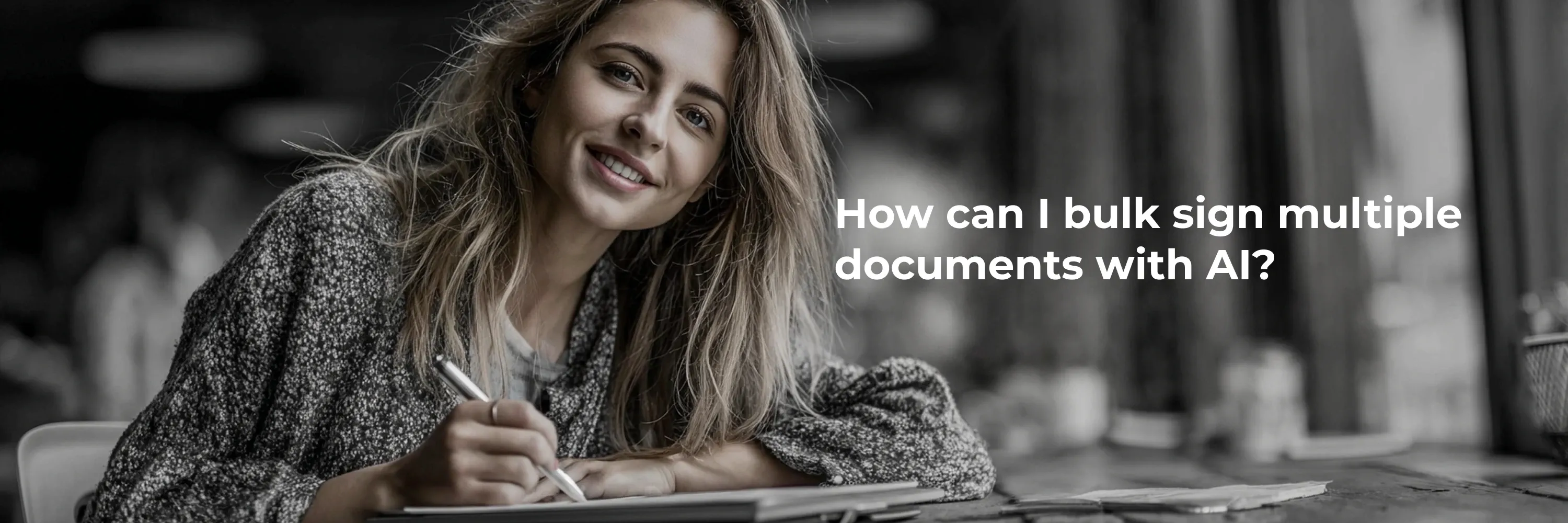 Woman using a tablet to sign documents digitally, illustrating how to bulk sign multiple documents with AI and eSignature software.